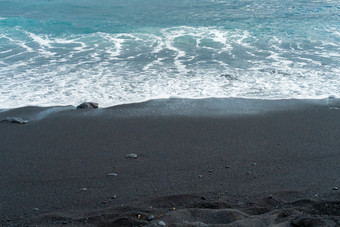 黑色的沙子<strong>海滩</strong>宏摄影柔滑的黑色的<strong>海滩</strong>纹理简约黑色的背景tenerife沃卡尼克桑迪<strong>海岸</strong>海洋波与白色泡沫卷在黑色的沙子<strong>海滩</strong>与卵石柔滑的黑色的<strong>海滩</strong>纹理简约黑色的背景tenerife沃卡尼克桑迪<strong>海岸</strong>