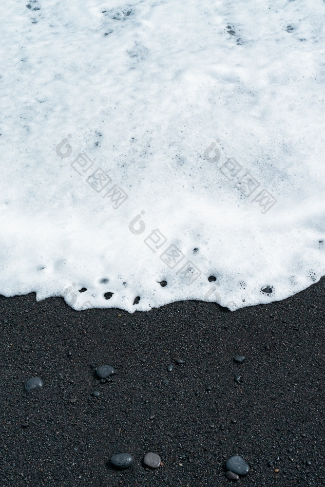 黑色的沙子海滩宏摄影柔滑的黑色的海滩纹理简约黑色的背景tenerife沃卡尼克桑迪海岸海洋波与白色泡沫卷在黑色的沙子海滩与卵石柔滑的黑色的海滩纹理简约黑色的背景tenerife沃卡尼克桑迪海岸