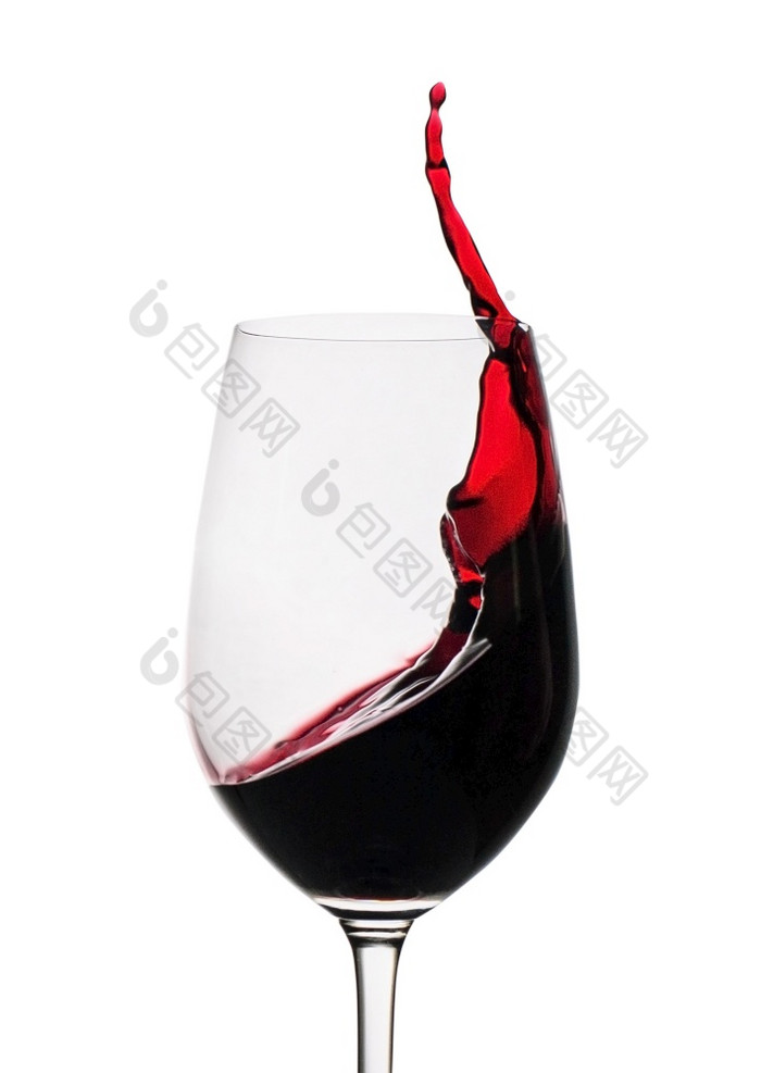 冻结运动红色的酒溅的一边葡萄酒杯孤立的白色与复制空间冻结运动红色的酒溅玻璃