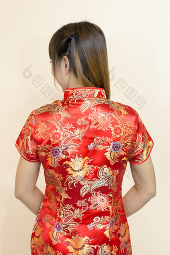 特写镜头回来亚洲女人问候传统的中国人旗袍中国人新一年庆祝活动红色的金风格