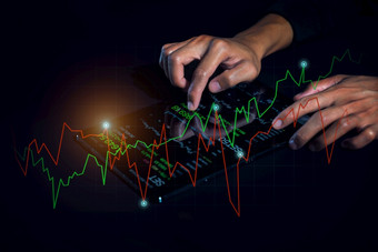 商人分析金融统计数据显示的平板电脑屏幕业务分析和金融技术概念
