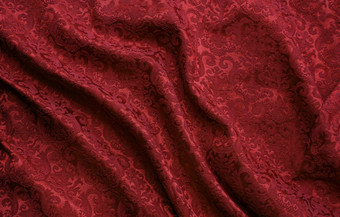 豪华的红色的锦织物与装饰大马士革模式