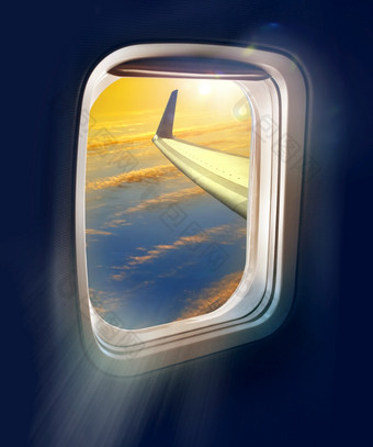 的新黎明飞行旅行明亮的日出视图从飞机飞机窗口高的蓝色的天空飞行旅行