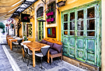 色彩斑斓的传统的希腊系列小街餐厅老小镇雷西姆诺克里特岛岛传统的酒馆狭窄的街道老小镇雷西姆诺克里特岛岛