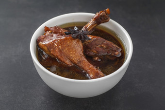 ped棕色（的）中国人红烧小腿<strong>鸭</strong>腿白色碗黑暗纹理背景泰国食物