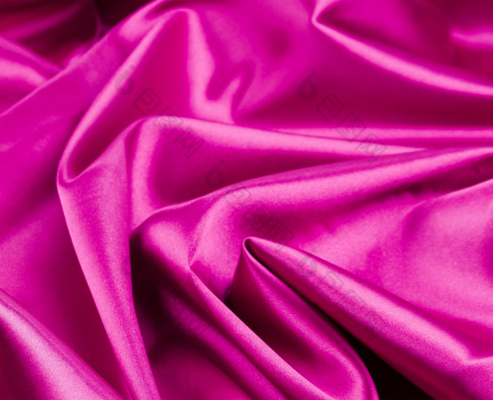 光滑的优雅的粉红色的丝绸背景光滑的优雅的粉红色的丝绸