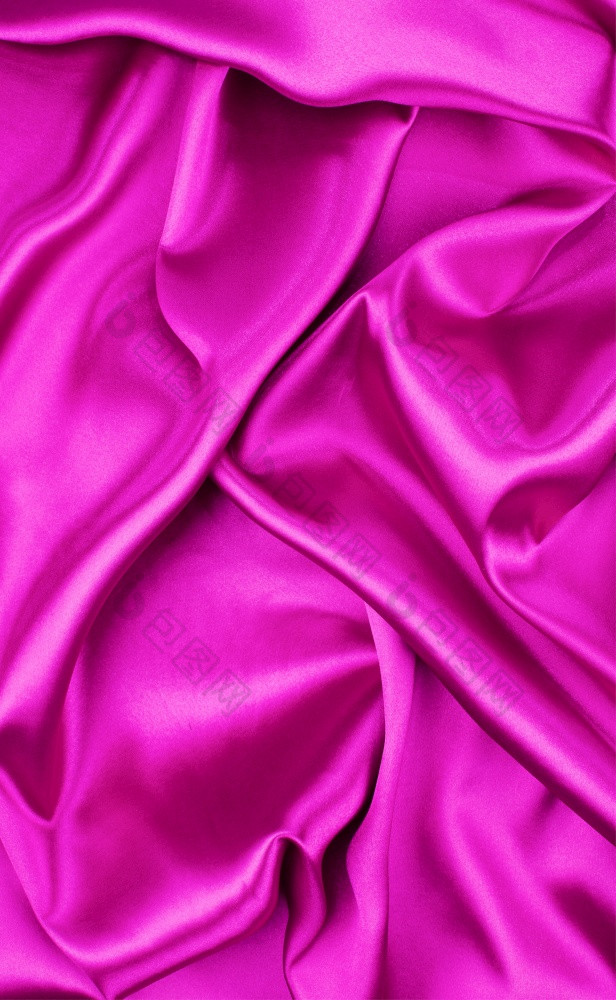 特写镜头波及紫色的丝绸织物背景特写镜头波及紫色的丝绸织物
