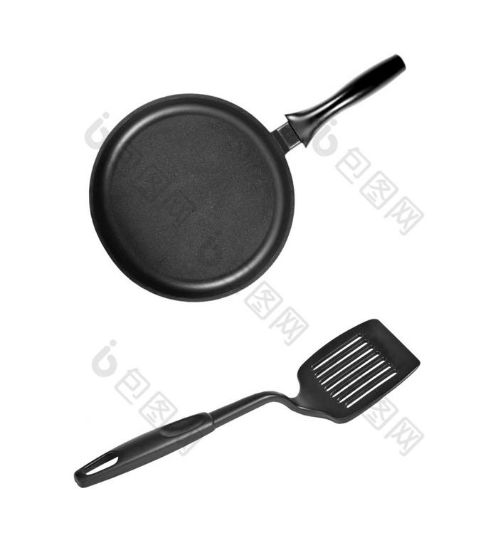 锅与黑色的塑料厨房抹刀孤立的白色锅与黑色的塑料厨房抹刀