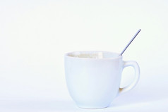 小白色杯咖啡与勺子孤立的清洁白色背景