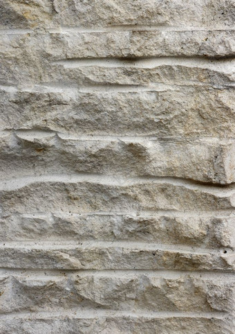 背景和纹理粗糙的饱经风霜的石头纹理外墙地板上乡村建筑粗糙的饱经风霜的石头纹理