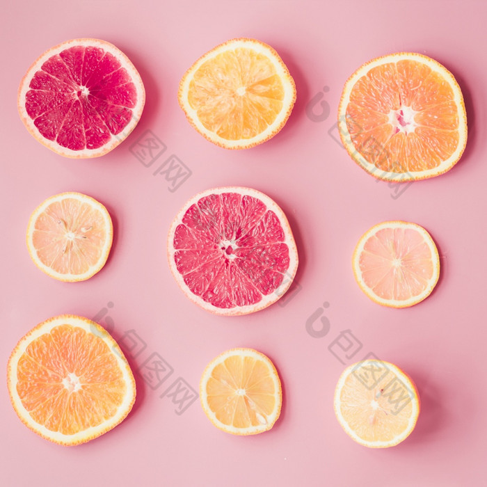 片新鲜的柑橘类水果粉红色的背景决议和高质量美丽的照片片新鲜的柑橘类水果粉红色的背景高质量和决议美丽的照片概念