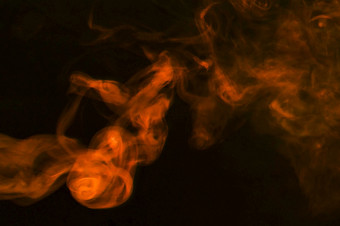 密集的烟雾摘要橙色烟黑暗背景高决议照片密集的烟雾摘要橙色烟黑暗背景高质量照片