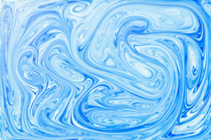风格埃布鲁绘画与蓝色的丙烯酸油漆漩涡