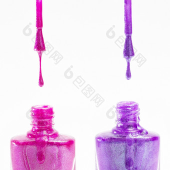 粉红色的紫色的指甲波兰的瓶白色背景