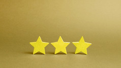 三个金星星黄色的背景质量服务买家选择成功业务的概念评级和评价的评级的酒店餐厅移动应用程序