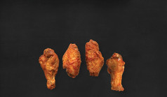 关闭视图美味的炸鸡孤立的黑色的背景合适的为你的食物设计项目