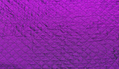 紫罗兰色的菱形织物背景