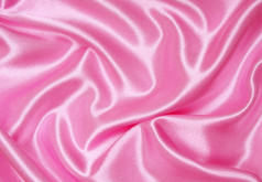光滑的优雅的粉红色的丝绸可以使用背景
