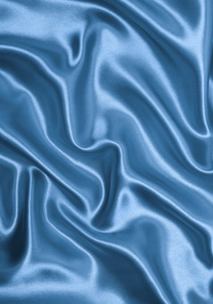 光滑的优雅的蓝色的丝绸可以使用背景
