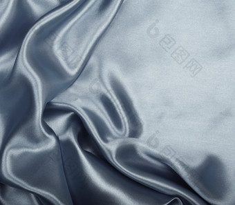 光滑的优雅的灰色丝绸缎可以使用背景