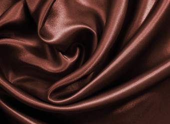 光滑的优雅的黑暗棕色（的）巧克力丝绸可以使用背景