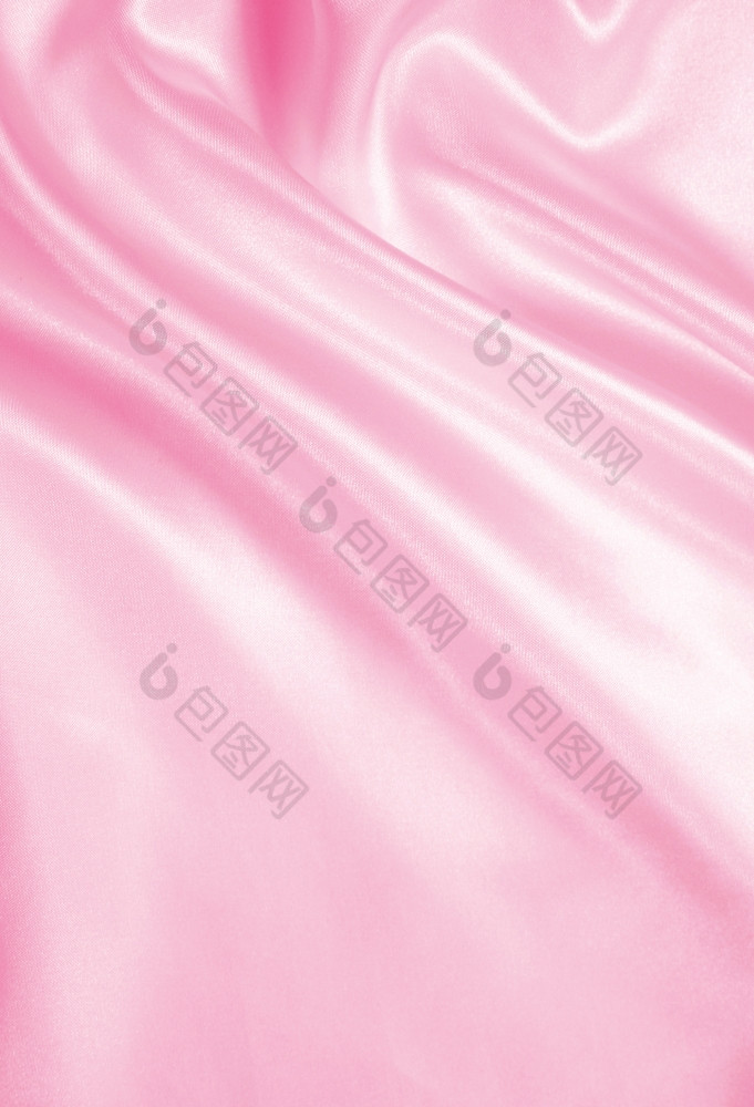 光滑的优雅的粉红色的丝绸缎可以使用婚礼背景
