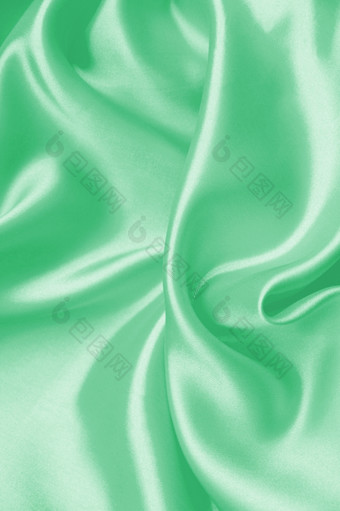 光滑的优雅的绿色丝<strong>绸缎</strong>纹理可以使用背景