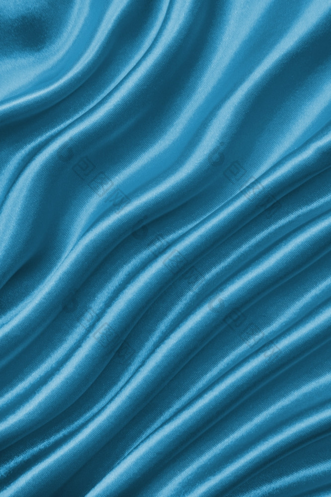 光滑的优雅的蓝色的丝绸缎可以使用背景
