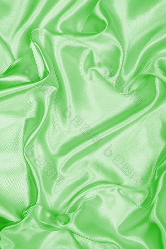 光滑的优雅的绿色丝<strong>绸缎</strong>纹理可以使用背景