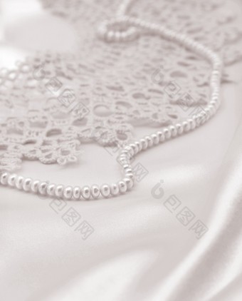光滑的优雅的金丝绸缎与珍珠和<strong>花边</strong>可以使用<strong>婚礼</strong>背景乌贼健美的复古的风格