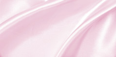 光滑的优雅的粉红色的丝绸缎纹理可以使用婚礼背景豪华的情人节一天背景设计