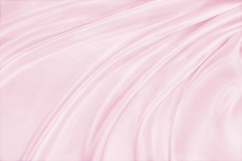 光滑的优雅的粉红色的丝<strong>绸缎</strong>纹理可以使用婚礼背景豪华的背景设计
