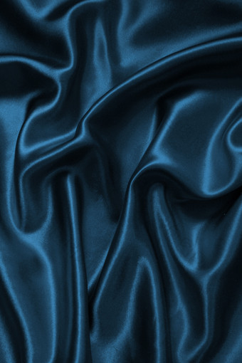 光滑的优雅的蓝色的丝<strong>绸缎</strong>奢侈品布纹理可以使用摘要背景豪华的背景设计