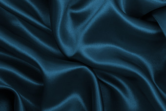 光滑的优雅的蓝色的丝绸缎奢侈品<strong>布纹</strong>理可以使用摘要背景豪华的背景设计