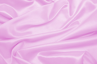 光滑的优雅的粉红色的丝绸缎纹理可以使用婚<strong>礼</strong>背景<strong>豪</strong>华的背景设计