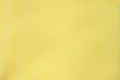 蜜蜂蜡黄色的纹理有趣的细节六角模式