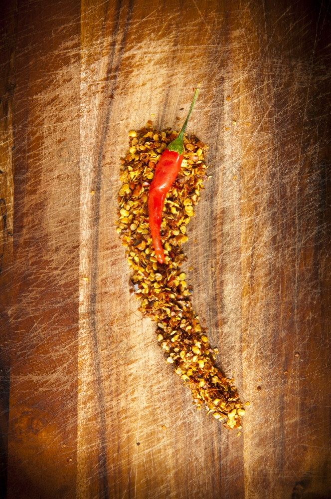 红色的热辣椒概念辣椒坐在在辣椒种子形状的就像辣椒