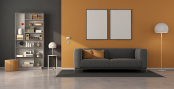 灰色的和橙色生活房间与沙发和书柜呈现现代生活房间与灰色的沙发和书柜