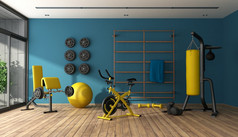 蓝色的首页健身房与冲拳击手cyle和其他健身设备呈现蓝色的首页健身房与黑色的和黄色的健身设备