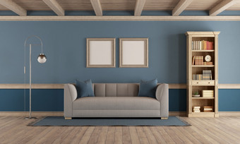 经典风格生活房间与优雅的沙发书柜和蓝色的墙呈现经典风格生活房间与复古的家具和蓝色的墙呈现