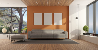 生活房间与大窗口和<strong>灰色</strong>的<strong>沙发</strong>对橙色墙呈现生活房间与大窗口和<strong>灰色</strong>的<strong>沙发</strong>