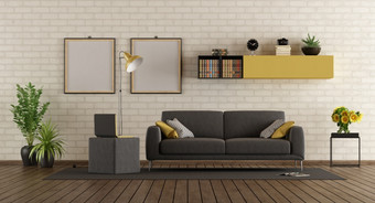 现代生活房间与灰色的沙发移动PC脚凳和砖墙呈现现代生活房间与沙发和砖墙