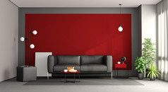 生活房间与黑色的沙发对红色的墙呈现生活房间与黑色的沙发