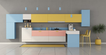 色彩斑斓的极简主义厨房与半岛和凳子呈现色彩斑斓的极简主义厨房与半岛