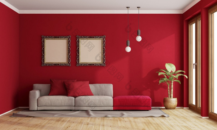 红色的生活房间与现代沙发和老框架墙呈现红色的生活房间与现代沙发