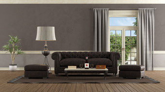 生活房间复古的风格与皮革沙发脚凳和窗口背景呈现生活房间复古的风格与皮革沙发