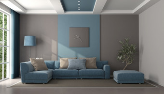 极简主义蓝色的和棕色（的）生活房间与沙发和脚凳呈现极简主义蓝色的和棕色（的）生活房间