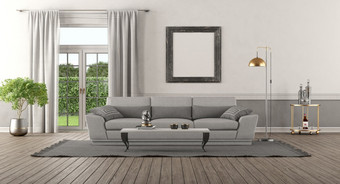 优雅的首页室内与灰色的沙发和窗户背景呈现优雅的首页室内与灰色的沙发