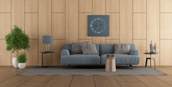 现代生活房间与蓝色的沙发对木paneling-d呈现木镶板现代生活房间与沙发