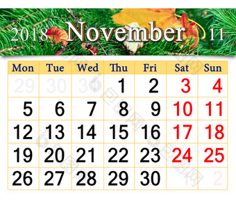 日历为11月与黄色的干叶的常绿云杉日历为11月与的丝带黄色的干叶的常绿云杉